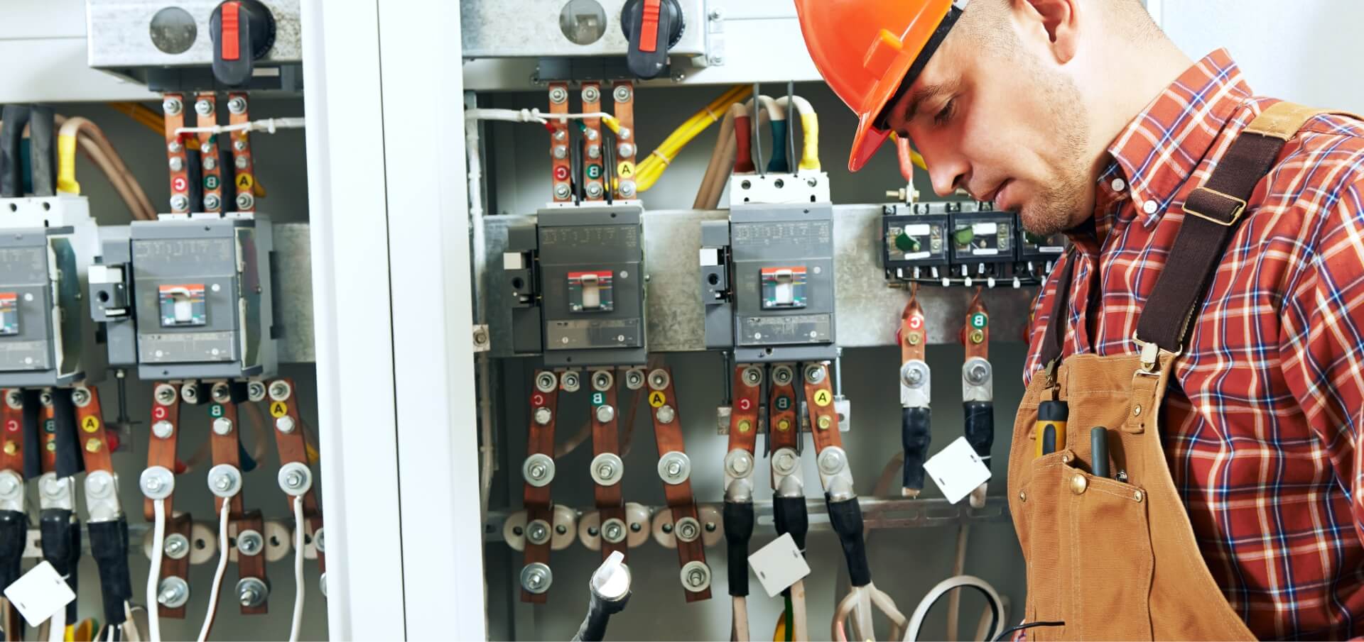 Electrical worker looking at valves