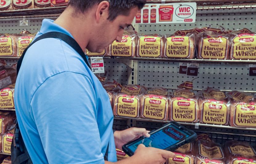 Schebels employee looking at tablet