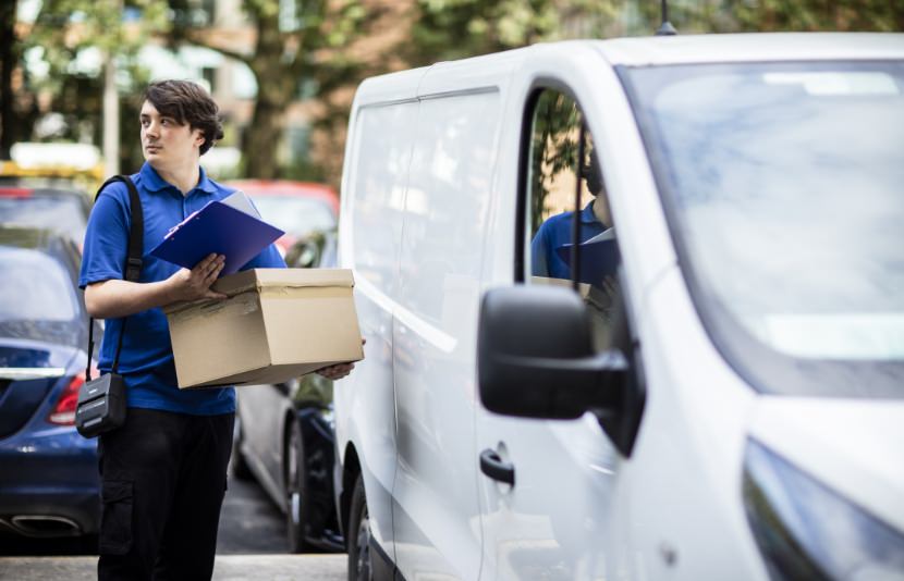 Route driver outside van with Ruggedjet 4 mobile printer