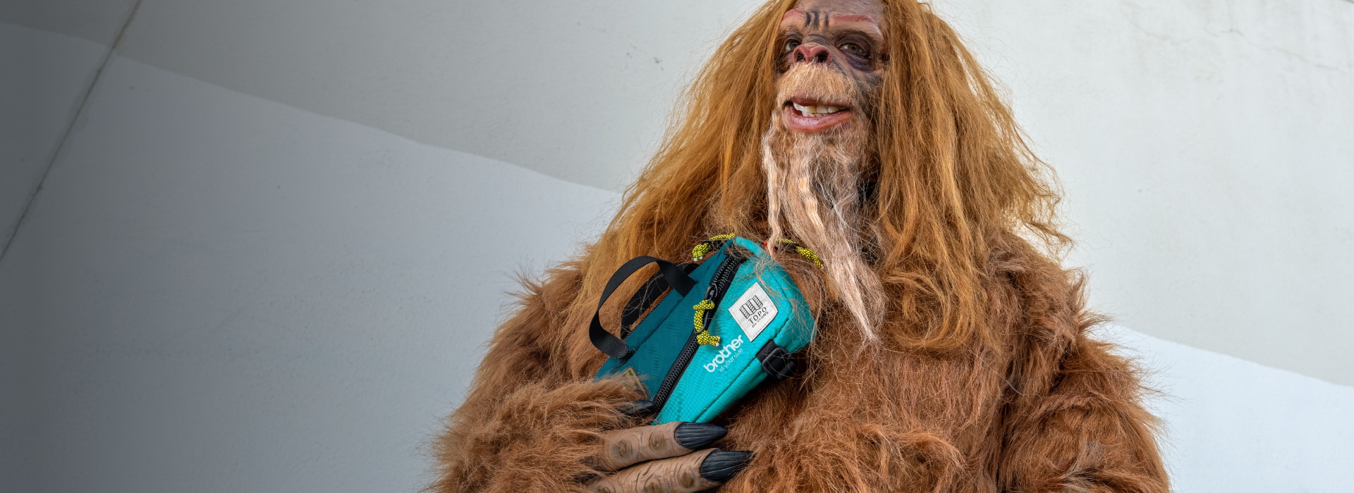 bigfoot holds brother branded fanny pack