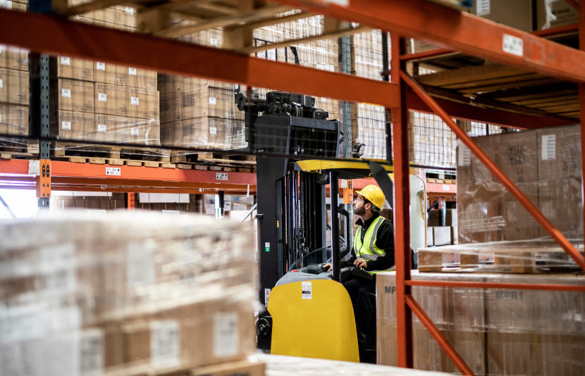 Forklift operator in a warehouse