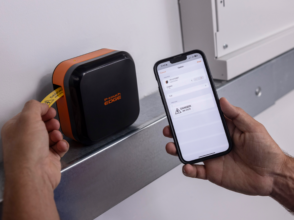 Using the P-touch EDGE 720BT and a smartphone app, someone prints a caution label.