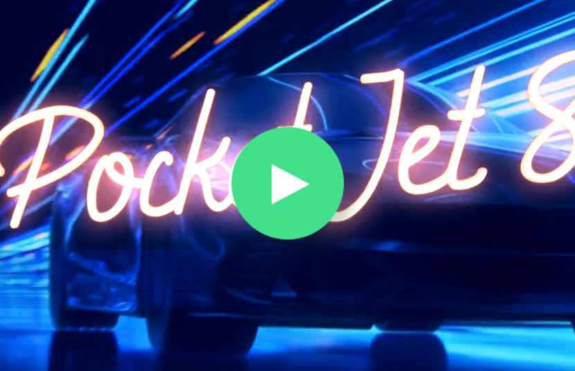 A sleek car with neon PocketJet 8 text and motion blur effects highlights high performance, with a play button overlaid in the center.
