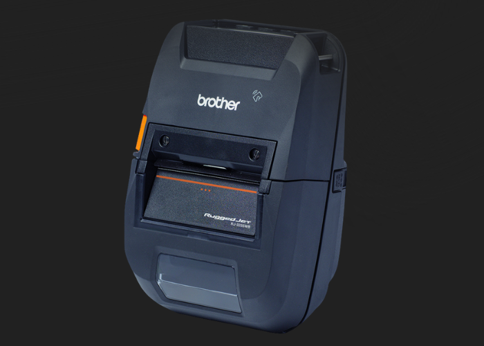 A black Brother portable label printer with buttons and a display slot, shown on a dark background.